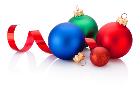 Christmas colored baubles and curling paper Isolated on white backgroundの写真素材