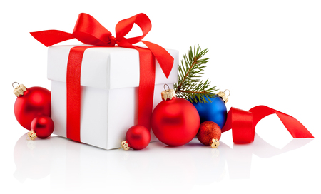 White gift box tied red ribbon bow and Christmas bauble Isolated on white backgroundの写真素材