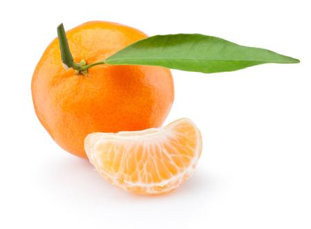 Tangerine with leaf and peeled slice isolated on white backgroundの写真素材