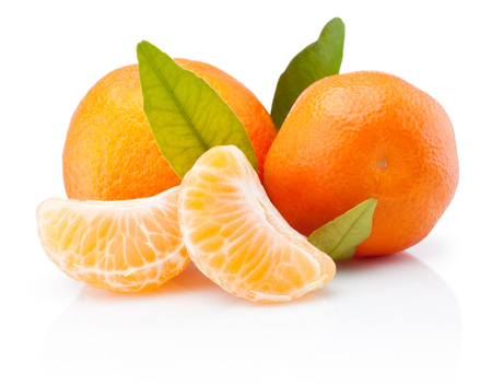 Two tangerines with leaves and peeled pieces isolated on white backgroundの写真素材