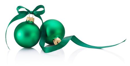 Two green Christmas baubles with ribbon bow isolated on a white backgroundの写真素材