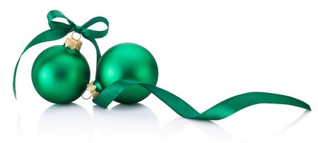 Two green Christmas baubles with ribbon bow isolated on a white backgroundの写真素材