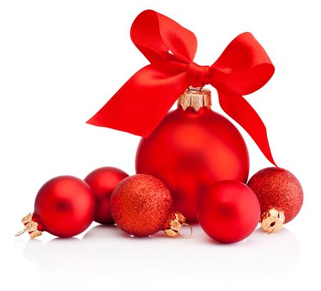 Christmas red baubles with ribbon bow isolated on a white backgroundの写真素材