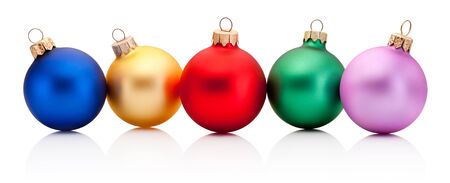 Five Christmas colored baubles Isolated on a white backgroundの写真素材
