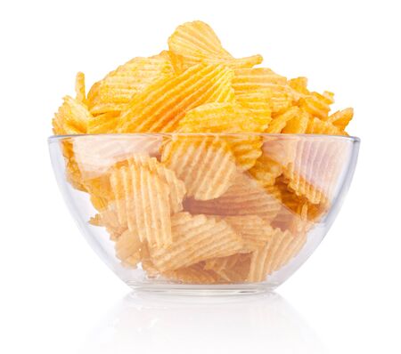Crinkle cut potato chips in bowl isolated on white backgroundの写真素材