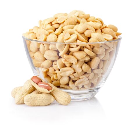 Peanuts in glass bowl isolated on a white backgroundの写真素材