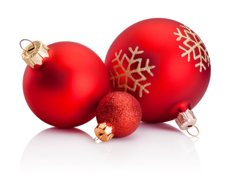 Three Christmas red baubles isolated on a white backgroundの写真素材