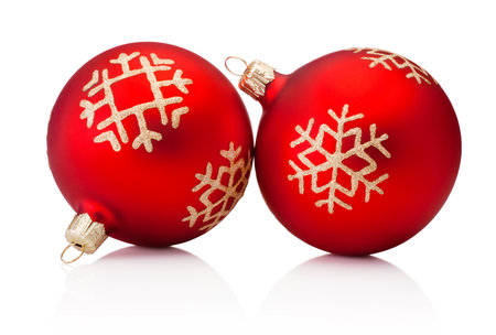 Two Christmas red decoration baubles isolated on a white backgroundの写真素材