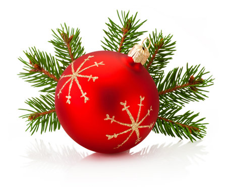 Christmas red decoration bauble and fir tree branch isolated on a white backgroundの写真素材