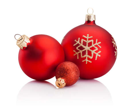 Three Christmas red baubles isolated on a white backgroundの写真素材