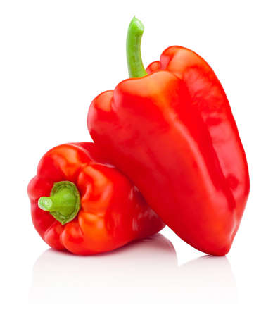 Two red sweet bell peppers isolated on a white backgroundの写真素材
