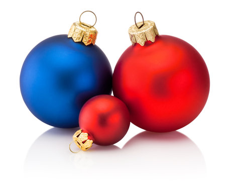 Three Christmas colored baubles Isolated on a white backgroundの写真素材