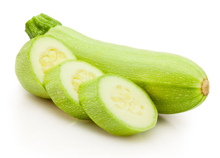 Sliced green vegetable zucchini isolated on a white backgroundの写真素材