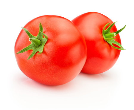 Two ripe red tomatoes vegetables isolated on a white backgroundの写真素材