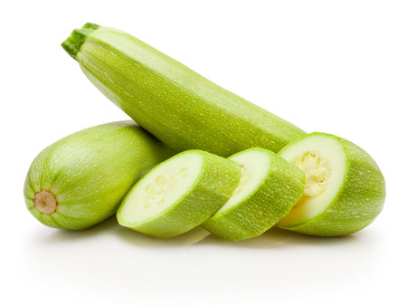 Sliced green vegetable zucchini isolated on a white backgroundの写真素材