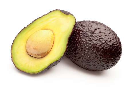 Avocado brown Hass with bone cut isolated on a white backgroundの写真素材