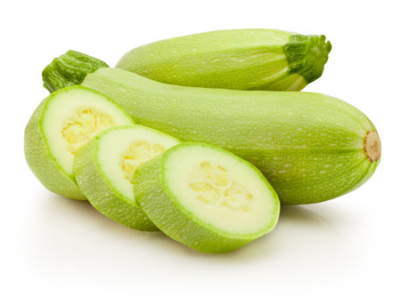 Sliced green vegetable zucchini isolated on a white backgroundの写真素材