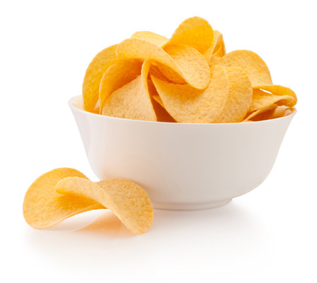 Potato chips in bowl isolated on a white backgroundの写真素材