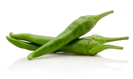 Green hot chili peppers isolated on a white backgroundの写真素材