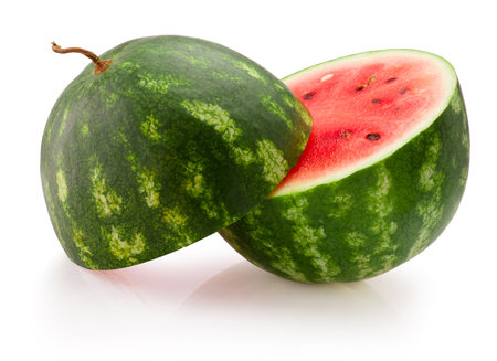 Cut in half round juicy watermelon isolated on a white backgroundの写真素材
