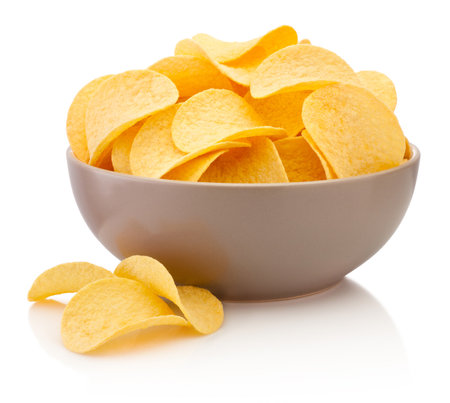 Potato chips in brown bowl isolated on a white backgroundの写真素材