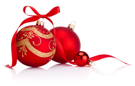 Christmas red decoration baubles with ribbon bow isolated on a white backgroundの写真素材