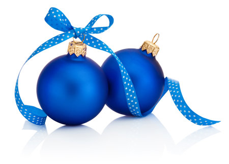 Two Christmas blue baubles with ribbon bow isolated on a white backgroundの写真素材