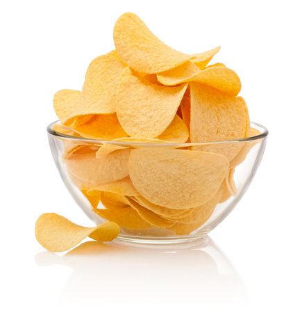 Potato chips in glass bowl isolated isolated on a white backgroundの写真素材