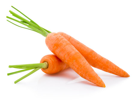 Three fresh carrot isolated on a white backgroundの写真素材