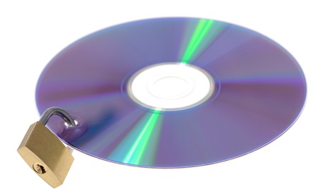 digital data security concept padlock locking cd dvd isolated on whiteの写真素材