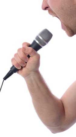 Profile of singing into microphone isolated on whiteの写真素材