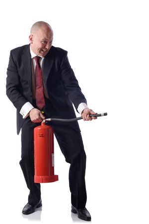 Businessman with fire extinguiser isolated on white  concept of putiing out fires resolving problems in buisness の写真素材