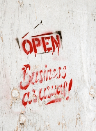 business open as usual painted on wodden boardの写真素材