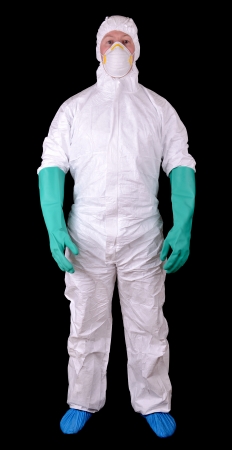 Man in full protective hazmat suit isolated on a black backgroundの写真素材
