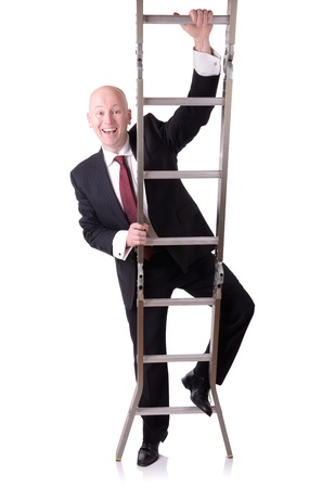 businessman starting on the ladder of success isolated on whiteの写真素材