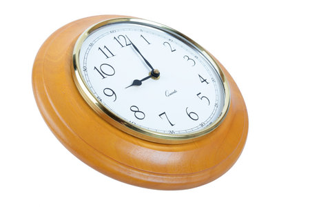 wooden wall clock showing 9 o