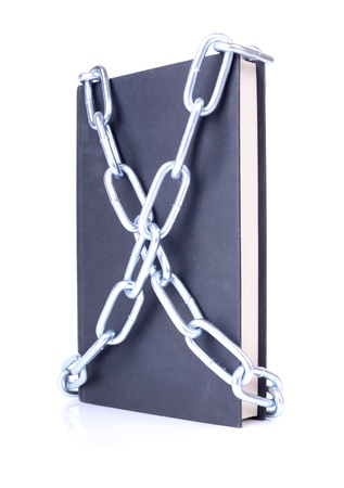concept of secure information a book chained up on white backgroundの写真素材