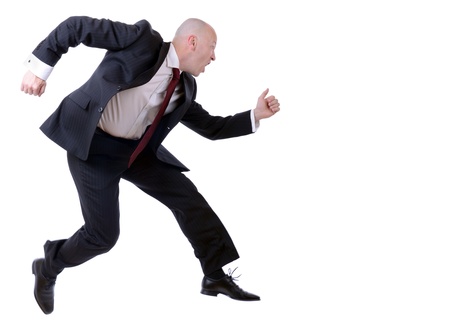 businessman running isolated on white background with slight motion blurrの写真素材