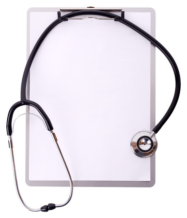 Making medical notes a stethoscope on a clipboard isolated on white with clipping pathの写真素材