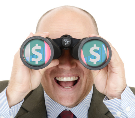 Man in suit looking at future growth of sock profit through binocularsの写真素材