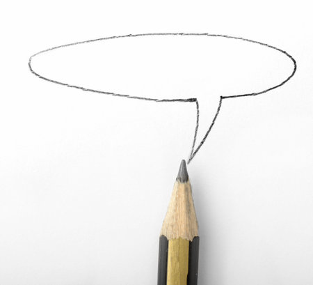 pencil with a speech bubble above it  on paper