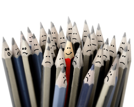 Concept of standing out in a crowd, one happy smileの写真素材