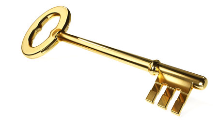 Old style golden key on a white backgroundの写真素材