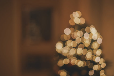 Close-up of Warm Orange Christmas Tree Bokeh (Light Blurs)の写真素材