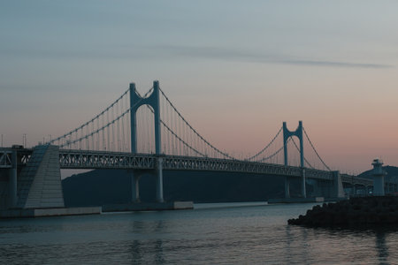 Majestic and Beautiful Night View of Gwangandaegyo Bridge in Busan, Korea, with Blue Hues at Duskの写真素材