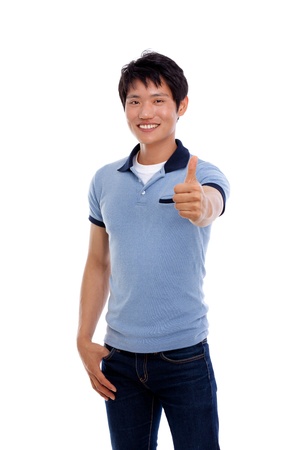 Happy smiling young Asian man show thumb isolated on white background の写真素材