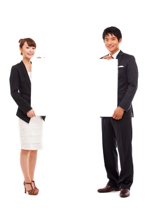 Business couple holding a add banner の写真素材