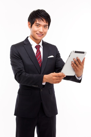 Using pad PC business man isolated on white background の写真素材