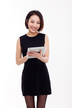 Using pad PC business woman isolated on white background の写真素材