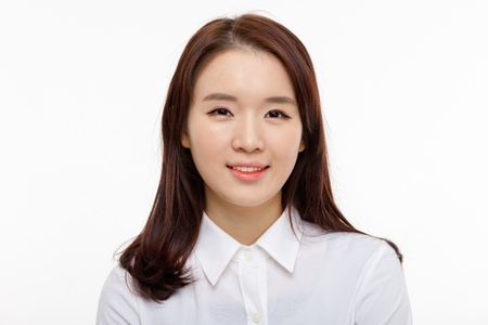 Young Asian pretty business woman close up portrait isolated on white background  の写真素材